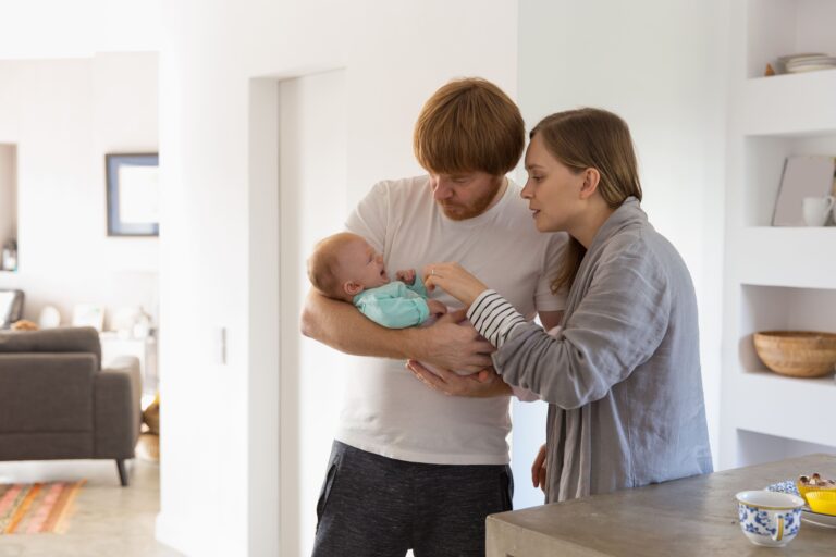 concerned-new-parents-holding-rocking-crying-baby (1)